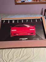 POWER PLAY Alpine promotional poster featuring red sports car