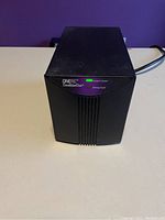 Front view of the Oneac power conditioner showing indicator LEDs and brand labels.