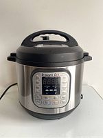 Front view of Instant Pot IP-DUO showing digital display and control buttons