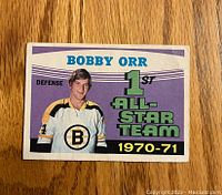 Front side of 1971-72 O-Pee-Chee Bobby Orr hockey card showing Bobby Orr in Bruins jersey with 1st All-Star Team 1970-71 designation.