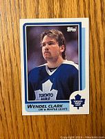 Front side photo of the 1986-87 Wendel Clark rookie hockey card showing player portrait and team identification.