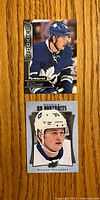 Two front view rookie hockey cards of William Nylander, showing player in Toronto Maple Leafs uniform from different card series.