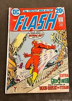 Front cover of The Flash comic book issue #221 showing Flash and promotional text about Green Lantern and story titles.