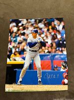 Front of 8x10 signed photo showing John Olerud batting with signature at bottom right.