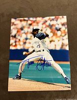 Front view of signed 8x10 photo showing Juan Guzman pitching in Toronto Blue Jays uniform with clear blue ink signature and number 46.