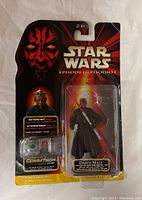 Front view of sealed Star Wars Episode I Darth Maul action figure in original blister packaging, showing figure and included CommTech chip.