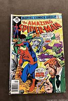 Front cover of The Amazing Spider-Man #170 comic book showing Spider-Man with Doctor Faustus and the Green Goblin.