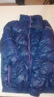 Front view of deep purple Columbia puffer jacket with zipper and pockets