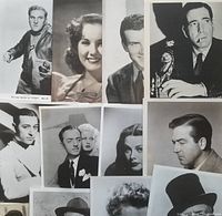 Photo showing a group of black and white vintage press photos featuring classic Hollywood actors, some with cigarette and guns, posed and candid portraits.