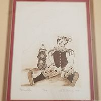 Full view of the framed etching showing the puppet character from the ballet "Petrushka" in sepia tones.