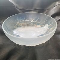 Front side view of the opalescent glass bowl showing the frosted grapevine leaves and grape clusters.