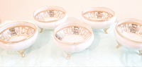 Set of five white porcelain fingerbowls with hand painted interior panels, gold trim on rims and feet. Markings confirmed on bottom for Nippon and Morimura.