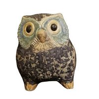 Front view of the Lladró Little Eagle Owl figurine showing detailed face with black eyes and beige-blue textured feathers.