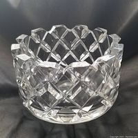 Front view of the clear cut crystal bowl showing the geometric pattern and scalloped rim.