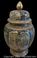 Front angle showing full decorated vase with lid and gold accents
