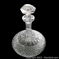 Angle showing full decanter with stopper in place, highlighting Lismore pattern cut into crystal.