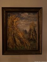 Full image of the framed oil painting showing hay stacks in a field under cloudy sky.