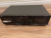 Front of Sony TC-WR590 stereo cassette deck showing control buttons, digital display, and cassette compartment.