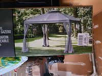 Front of box showing assembled gazebo image and product title
