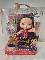 Front view of new Bratz Big Babyz Crazy Karaoke Jade doll in original packaging, showing doll with microphone and karaoke machine accessory, packaging with branding and text.