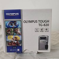 Front of the original Olympus Tough TG-820 camera box displaying key features such as waterproof, shockproof, and freezeproof ratings.