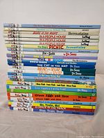 Stack of 23 children's books showing titles from Dr. Seuss, Berenstains, Richard Scarry, Awdry, and others.