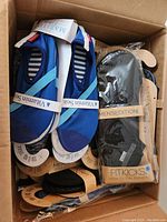 Box of assorted FitKicks packages seen from above