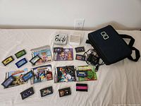 Overview of console, carrying case, charger, cartridge box, and loose cartridges