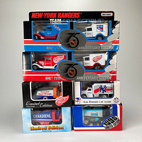 Front stacked view of six diecast team vehicles in original boxes showing NHL and MLB teams, Matchbox and White Rose branding.