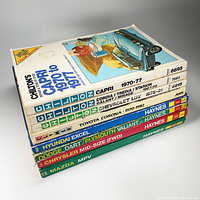 Stack of 8 assorted car repair manuals from Chilton, Clymer, and Haynes brands showing titles and wear.