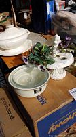Photo showing the Hall's pottery casserole dish with glass lid, Tedford tureen, and bird planter with flowers