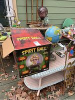 Image of the Spirit Ball box on a table with surrounding items showing the packaging and branding.