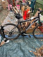 Full left side view of the black Schwinn Ranger mountain bike showing frame, tires, seat, and handlebar details.