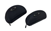 Two black Oakley semi-rigid sunglass cases, front angled view showing zipper pulls and Oakley logos on top surfaces