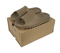 Front and side angle view of brown Yeezy Slides on top of original cardboard box