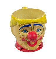 Front view of vintage ceramic Ringling Bros Barnum & Bailey clown mug showing colorful painted face with red nose and smiling mouth.