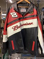 Front view of the black, red, and white leather racing jacket with zippered front and Budweiser branding.