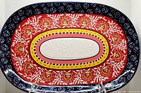 Full top-down view of the oval ceramic serving platter showing the entire BOHO pattern and color scheme.