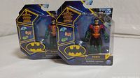 Photo showing two new in box Robin mini figures in blister packaging with Batman logo and accessory icons.