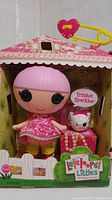 Front view of Lalaloopsy Littles Trinket Sparkles doll in original packaging with small pet figure.