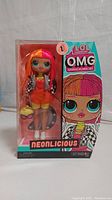 Front view of LOL Surprise OMG Neonlicious doll in original unopened packaging, showing doll and box art.