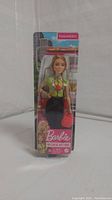 Front and slightly angled view of Paramedic Barbie in original sealed packaging showing doll details and accessories.