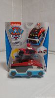 Front view of Paw Patrol True Metal Paw Patroller truck set in original packaging showing Ryder figure and red ATV vehicle attached on top.