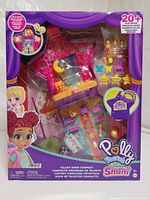 Front view of boxed Polly Pocket Starring Shani Talent Show Compact case showing colorful playset with mini figures and stage inside transparent window.