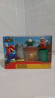 Front view of the unopened Super Mario Desert Diorama Set box showing all figures and accessories inside.