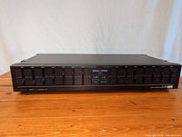 Front view of the Sansui SE-300 stereo graphic equalizer showing all slider controls and power switch.