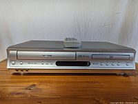 Front view of Toshiba VHS/DVD combo player model SD-291U showing VHS and DVD slots, control buttons and input jacks.