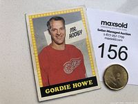 Front side photo of Gordie Howe hockey card showing image of player in Detroit Red Wings jersey with 'MR. HOCKEY' text.