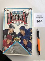 Front view of sealed box showing NHL logo, player images, and original shrink wrap with Upper Deck markings.