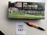 Top view of sealed green box showing '1991 PGA Tour Set' with Pro Set and PGA Tour logos and golf scene.
